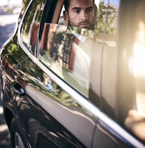On his way into work. Cropped shot of a handsome young businessman on his morning commute to work